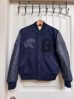 TNA League Bomber Jacket In Navy Blue with wool-blend body & leather sleeves. XS